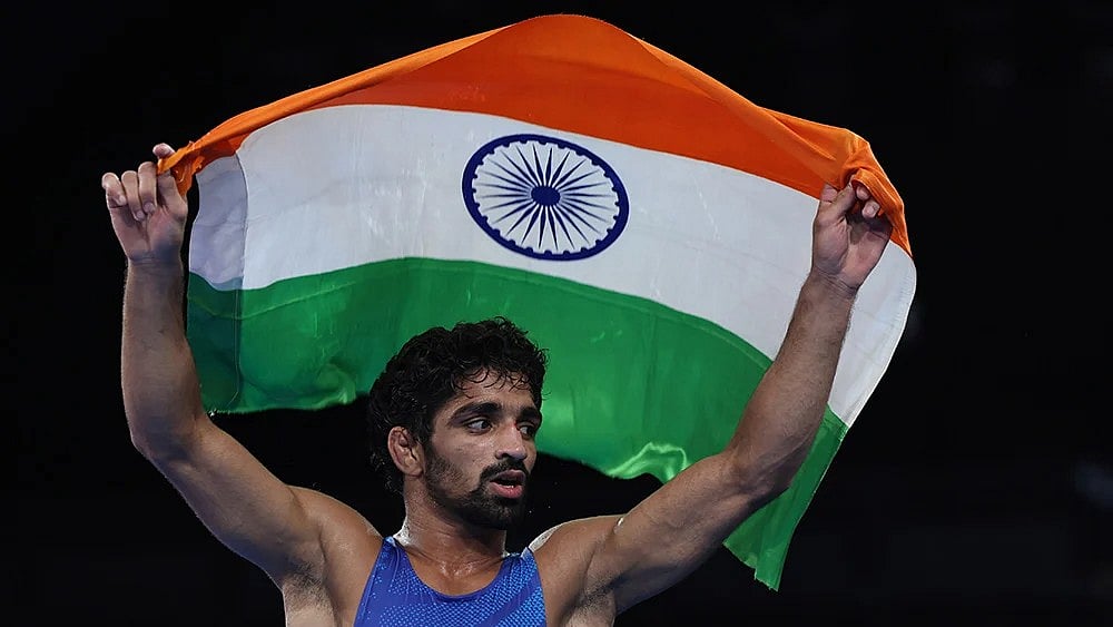 | Photo: EPA-EFE/VASSIL DONEV VIA PTI : Men's 57kg free-style wrestling: Aman Sehrawat of India celebrates defeating Darian Toi Cruz of Puerto Rico 